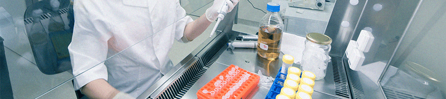 A chemist inside a lab with urine test samples