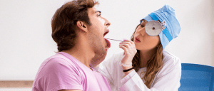 A patient doing a swab drug test with a doctor inside the clinic