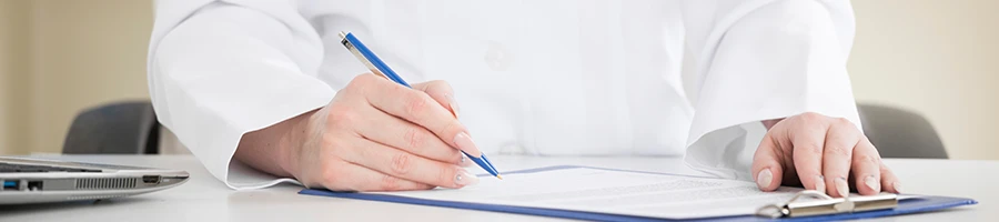 An image of a doctor writing down a prescription after a TCA test