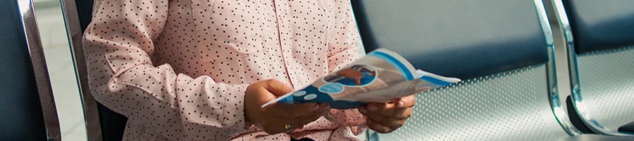 A woman reading the instructions on how to use the incognito belt