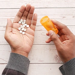 A top view of a person holding a large amount of drugs