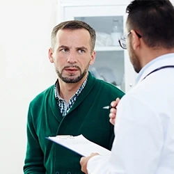 Patient and doctor discussing a follow-up drug test